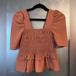 Doing It All Brick Orange Smocked Top
Mocked, puff sleeve top 🍂🍁 brick orange